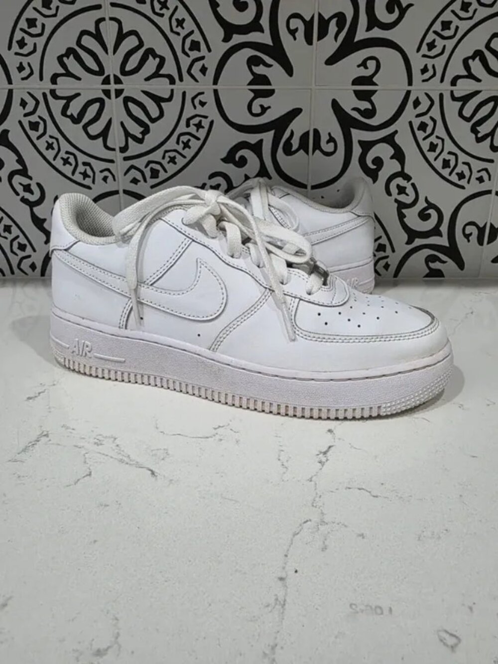 Size 7 Youth all-white Nike Air Force 1 LE low-top sneakers